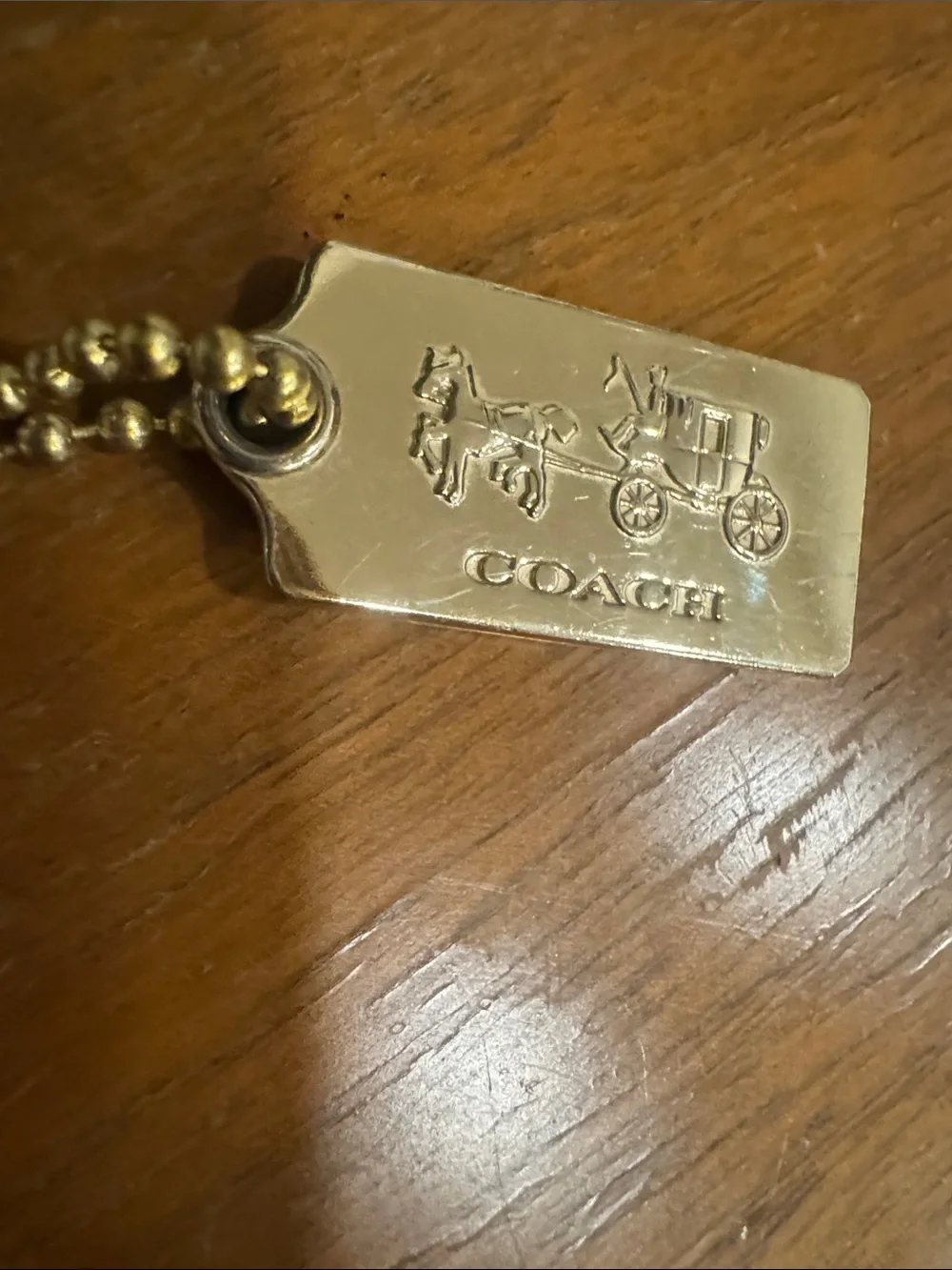 COACH Gold-tone Coach Carriage Tag Charm - Gold